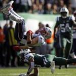 New England Patriots wide receiver Julian Edelman flips after being hit by New York Jets cornerback Darryl Roberts (27) during an NFL football game Sunday, Nov. 25, 2018, in East Rutherford, N.J. (AP Photo/Adam Hunger)
