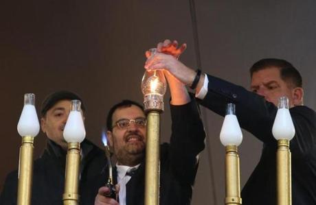 Mayor Martin J. Walsh and Rabbi Rachmeil Liberman of Congregation Lubavitch Synagogue lit the menorah in Downtown Crossing on Sunday.
