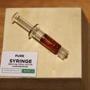 Leicester, MA, 11/20/2018 -- A Pure Syringe on display at the opening of Cultivate, one of the state's first two pot shops. This the first day the store can sell recreational marijuana to adults 21 and older. (Jessica Rinaldi/Globe Staff) Topic: 21potopen Reporter: 