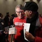 Brian Lang, left, president of Unite Here Local 26 in Boston, spoke at a news conference last month about the settlement of the strike against Marriott Hotels in Boston. 