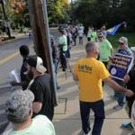 Locked out National Grid workers picketed a work site in Woburn.