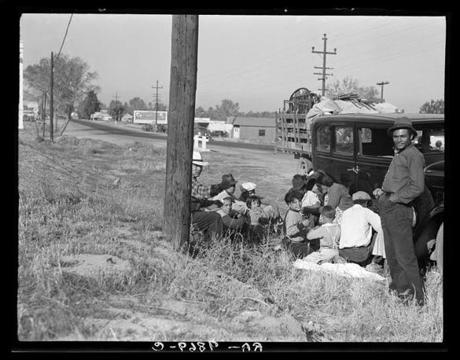 Mexicans bound for the Imperial Valley to harvest peas. Near Bakersfield, California, November 1936. Public domain
