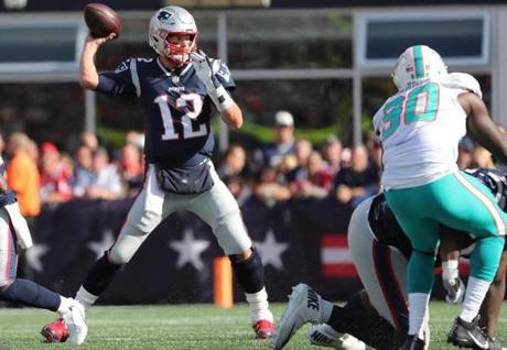 Foxborough, MA 09/30/18: New England Patriots Tom Brady throws a pass against the Miami Dolphins during third quarter action at Gillette Stadium Sunday, Sept. 30, 2018. (Matthew J. Lee/Globe Staff)
