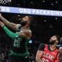 Boston MA 12/10/18 Boston Celtics Marcus Morris is fouled by New Orleans Pelicans Anthony Davis during first quarter action at TD Garden (photo by Matthew J. Lee/Globe staff) topic: 16allschopics reporter: 