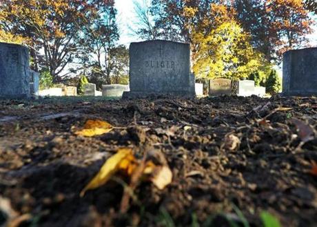 West Roxbury, MA: 11-8-18: The freshly dug up dirt is pictured in front of a headstone where James 