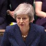A video grab from footage broadcast by the UK Parliament's Parliamentary Recording Unit (PRU) shows Britain's Prime Minister Theresa May attending the weekly Prime Minister's Questions (PMQs) in the House of Commons in London on December 12, 2017. - Prime Minister Theresa May was on Wednesday to face a vote of no-confidence by MPs in her party over her handling of negotiations with the European Union about Britain's exit from the bloc. May said she will contest a confidence vote in her leadership 