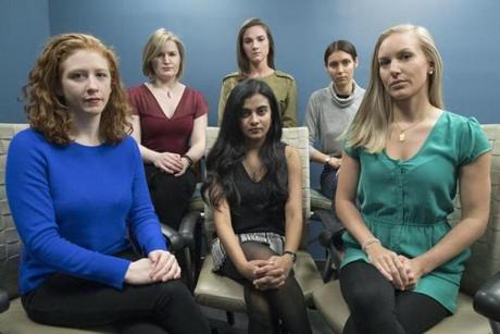 FILE - In this Nov. 14, 2018 file photo, from left back row, Annemarie Brown, Andrea Courtney, and Marissa Evansin, and from left front row, Sasha Brietzke, Vassiki Chauhan, Kristina Rapuano, pose in New York. The women filed a lawsuit against Dartmouth College for allegedly allowing three professors to create a culture in their department that encouraged drunken parties and subjected female graduate students to harassment, groping and sexual assault. A growing number of former students are demanding answers from the administration and questioning how such an atmosphere apparently flourished for at least 15 years at the Ivy League school in Hanover, N.H. (AP Photo/Mary Altaffer, File)
