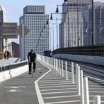 CAMBRIDGE, MA - 12/12/2018:Bicycle advocates in Cambridge and Boston are asking state transportation officials to reconsider plans to remove newly-installed plastic bollards separting the bike lane from the busy car lanes across the Longfellow Bridge this winter.(David L Ryan/Globe Staff ) SECTION: METRO TOPIC 13longfellow