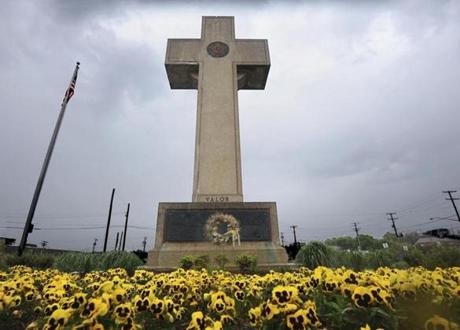 FILE - In this May 7, 2014 file photo, the World War I memorial cross is pictured in Bladensburg, Md. The Supreme Court has agreed to consider whether a nearly 100-year-old, cross-shaped war memorial located on a Maryland highway median violates the Constitution's required separation of church and state. The court announced Friday, Nov. 2, that it would hear the case. (Algerina Perna /The Baltimore Sun via AP, File)
