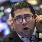 A trader at the New York Stock Exchange got to work Friday after the opening bell.