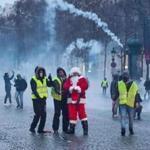 Protesters wearing yellow vests, and one dressed as Santa Claus demonstrated in Paris against rising costs of living. 