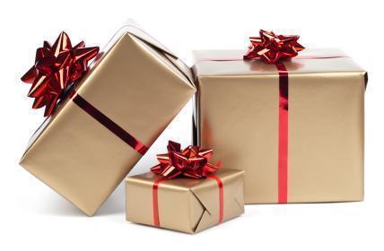 Gold gift boxes with red ribbon on white. This file contains clipping path.

