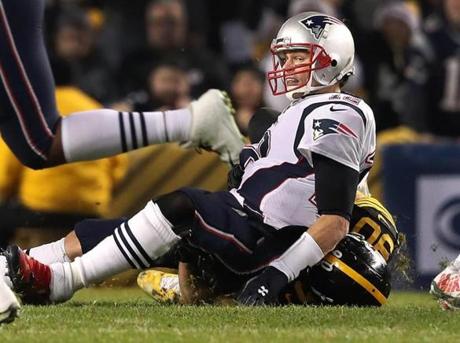 Pittsburgh, PA 12-16-18: Pitsburgh LB T.J. Watt took Patriots quarterback Tom Brady to the turf as he rushed him into throwing an incomplete pass. The New England Patriots visited the Pittsburgh Steelers in a regular season NFL football game at Heinz Field. (Jim Davis/Globe Staff)
