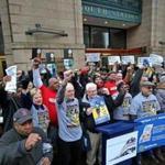 Amtrak workers and their supporters at South Station Monday protested cuts in dining service, and the possible outsourcing of food and beverage jobs. 