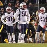 Pittsburgh, PA 12-16-18: Patriots defenders (left to right) Devin McCourty (32), Jason McCourty (30), Malcolm Brown 990), Patrick Chung (23) and Jonathan Jones (31) are pictured after Steelers WR Antonio Brown (84, backround) had just caught a touchdown pass against them. The New England Patriots visited the Pittsburgh Steelers in a regular season NFL football game at Heinz Field. (Jim Davis/Globe Staff)