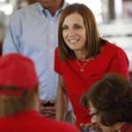 FILE - In this Nov. 6, 2018, file photo, Arizona Republican senatorial candidate Martha McSally, speaks with voters, at Chase's diner in Chandler, Ariz. Arizona's governor has named McSally to replace U.S. Sen. Jon Kyl in the U.S. Senate seat that belonged to Sen. John McCain. Republican Gov. Doug Ducey announced Tuesday, Dec. 18, that McSally will take over after Kyl's resignation becomes effective Dec. 31. McSally lost the Senate race to Democratic Rep. Kyrsten Sinema. (AP Photo/Matt York, File)