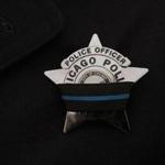 A Chicago Police mourning badge during a service for a slain officer last month.
