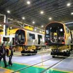 New Orange Line cars on the production floor of CRRC Corp.?s factory in Springfield.