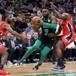 Boston MA 12/10/18 Boston Celtics Jaylen Brown drives to the basket on New Orleans Pelicans Jrue Holiday (right) and Soloman Hill during first quarter action at TD Garden (photo by Matthew J. Lee/Globe staff) topic: 16allschopics reporter: 