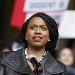 Ayanna Pressley, the democratic winner of the Massachusetts 7th congressional district speaks at a rally at City Hall against Judge Brett Kavanaugh, Monday, Oct. 1, 2018, in Boston. (AP Photo/Mary Schwalm)