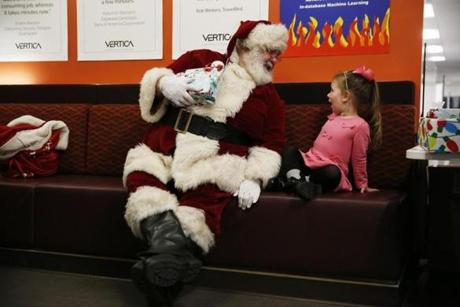 Cambridge, MA, 12/19/2018 -- Santa Ed Donlan chatted with Keeley Arnold, 3, of Danvers (R) during an office Holiday party at a local tech company called Vertica. (Jessica Rinaldi/Globe Staff) Topic: 20badsantas Reporter: 
