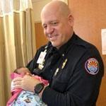 Paramedic Mickey Huber held 2-day-old Zoele Mickey Skinner on Dec. 14. 