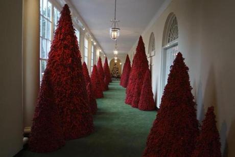 Topiary trees line the East colonnade during the 2018 Christmas Press Preview at the White House in Washington, Monday, Nov. 26, 2018. Christmas has arrived at the White House. First lady Melania Trump unveiled the 2018 White House holiday decor on Monday. She designed the decor, which features a theme of 