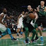 Boston, MA, 12/23/2018 -- Celtics Kyrie Irving (C) drives to the net against the Hornets during the second quarter of play at TD Garden. (Jessica Rinaldi/Globe Staff) Topic: Reporter: 