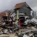 A man inspected the wreckage in Anyar, Indonesia, on Sunday following the tsunami.