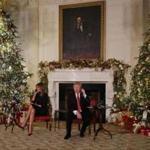 WASHINGTON, DC - DECEMBER 24: U.S. President Donald Trump (R) and first lady Melania Trump take phone calls from children as they participates in tracking Santa Claus' movements with the North American Aerospace Defense Command (NORAD) Santa Tracker on Christmas Eve in the East Room of the White House December 24, 2018 in Washington, DC. This is the 63rd straight year that NORAD has publicly tracked Santas sleigh on its global rounds. (Photo by Chip Somodevilla/Getty Images)