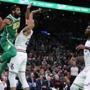 Boston MA 12/25/18 Boston Celtics Kyrie Irving making a baseline pass with pressure from Philadelphia 76ers Ben Simmons during first quarter NBA action at TD Garden. (photo by Matthew J. Lee/Globe staff) topic: reporter: 