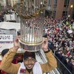 Mookie Betts hoisted the World Series trophy at the Red Sox victory parade.