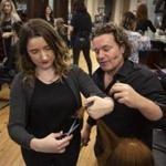 Melanie Warner left works on her hair cutting techniques with educator/stylist Alex Paulsen at Salon Herdis in Northampton, Mass. The owner of Salon Herdis is pre-emptively raising the wages of entry-level employees.