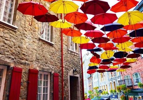 QUEBEC CITY, Sept. 29. I've spotted these umbrella art displays in several cities, but I was particulary fond of this one in Quebec. It seemed like a perfect match to the season and surrounding colors.
