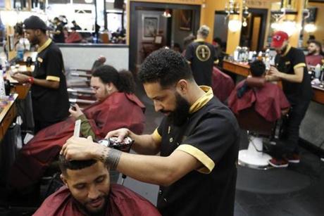 Lex Andre Daluz, owner of Marvelous Cuts, shaped up Amalex Veiga's hair.
