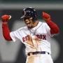 BOSTON, MA - OCTOBER 14: Mookie Betts #50 of the Boston Red Sox celebrates his two-run double during the eighth inning against the Houston Astros in Game Two of the American League Championship Series at Fenway Park on October 14, 2018 in Boston, Massachusetts. (Photo by Maddie Meyer/Getty Images)