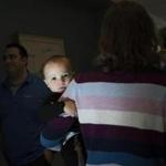 Ipswich, MA - Oct. 25, 2018: Olivier, 16 months, is carried by his mom at the annual Halloween party in the office in Ipswich, Mass., on Oct. 25, 2018. His dad works at NEB. For almost 30 years, New England Biolabs has provided on-site child care. (Michelle Jay) Topic: 111818TPTWMoms