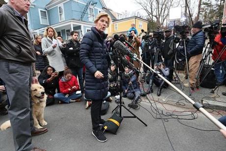 Cambridge, Ma., 12/31/2018, Senator Elizabeth Warren and her husband Bruce and dog Bailey greet the media outside her home after announcing she has launched an exploratory committee for President 2020. Suzanne Kreiter/Globe staff 
