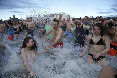 South Boston, MA, 01/1/2019 -- People run into the water during the L Street Brownies annual New Year polar plunge. (Jessica Rinaldi/Globe Staff) Topic: 02plunge Reporter: 
