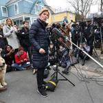 Cambridge, Ma., 12/31/2018, Senator Elizabeth Warren and her husband Bruce and dog Bailey greet the media outside her home after announcing she has launched an exploratory committee for President 2020. Suzanne Kreiter/Globe staff 