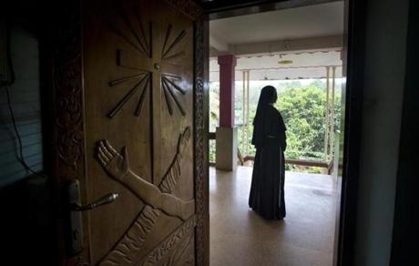 A Catholic nun stood at the foyer of the St. Francis Mission Home in Kuravilangad in the southern Indian state of Kerala. 
