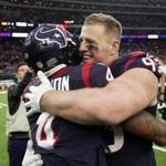 Houston Texans quarterback Deshaun Watson (4) and defensive end J.J. Watt (99) embrace after their win over the Jacksonville Jaguars in an NFL football game, Sunday, Dec. 30, 2018, in Houston. (AP Photo/)