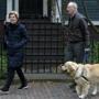 Senator Elizabeth Warren, a Massachusetts Democrat, stepped outside her Cambridge home with her husband Bruce Mann and their retriever Bailey on Monday.