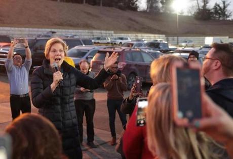 Senator Elizabeth Warren greeted voters Friday at a Council Bluffs, Iowa, bar.
