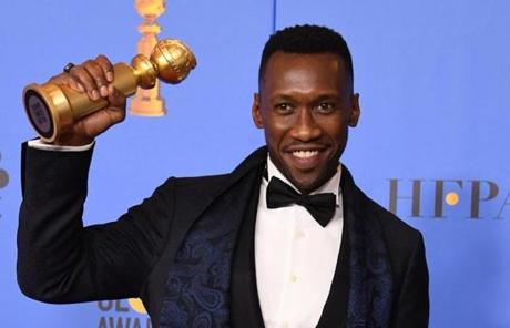 Best Actor in a Supporting Role in any Motion Mahershala Ali poses with his award for best supporting role in a motion picture.

