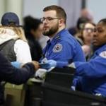 Transportation Security Administration officers work at a checkpoint at Logan International Airport in Boston, Saturday, Jan. 5, 2019. (AP Photo/Michael Dwyer)