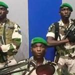 A screengrab of a YouTube video of Gabon soldiers in a state radio studio on Monday morning. 