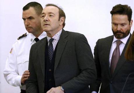 Actor Kevin Spacey enters the courtroom at district court for arraignment on a charge of indecent assault and battery on Monday, Jan. 7, 2019, in Nantucket, Mass. The Oscar-winning actor is accused of groping the teenage son of a former Boston TV anchor in 2016 in the crowded bar at the Club Car in Nantucket. (Nicole Harnishfeger/The Inquirer and Mirror via AP, Pool)
