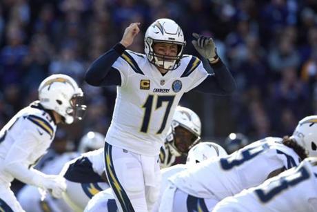 Los Angeles Chargers quarterback Philip Rivers (17) prepares to run a play in the first half of an NFL wild card playoff football game against the Baltimore Ravens, Sunday, Jan. 6, 2019, in Baltimore. (AP Photo/Gail Burton)
