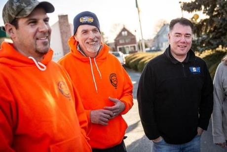 01/07/2019 MALDEN, MA 12012-4 union members L-R David Monahan (cq), Barry Johns (cq), and John Buonopane (cq) talk with fellow National Grid workers as they react to vote on new contract to end six-month lockout at the Irish American Club in Malden. (Aram Boghosian for The Boston Globe)
